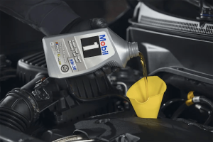 Certified technician performing oil change service in Orangeville